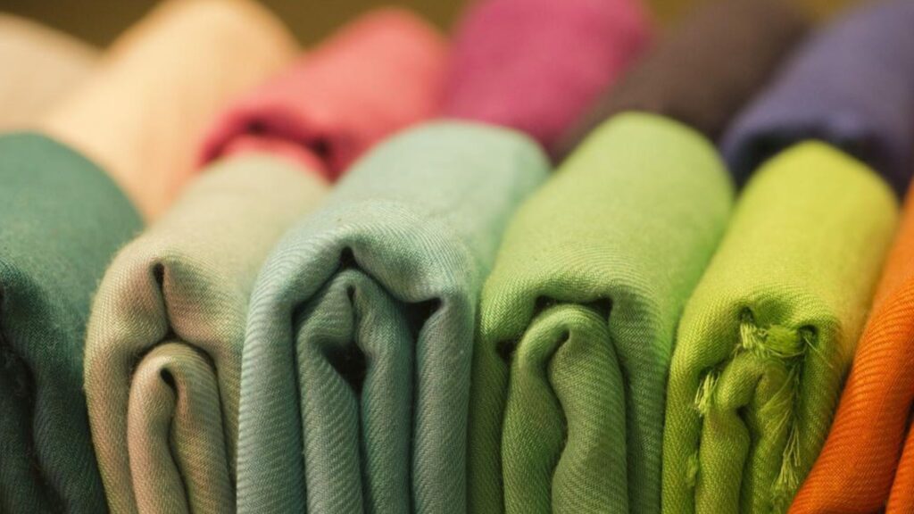 An assortment of different coloured fabrics showcasing reputable wholesale fabric supplier
