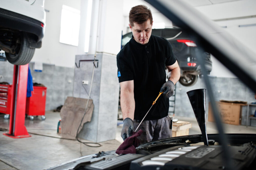 Mechanic doing Dpf filter cleaning of car